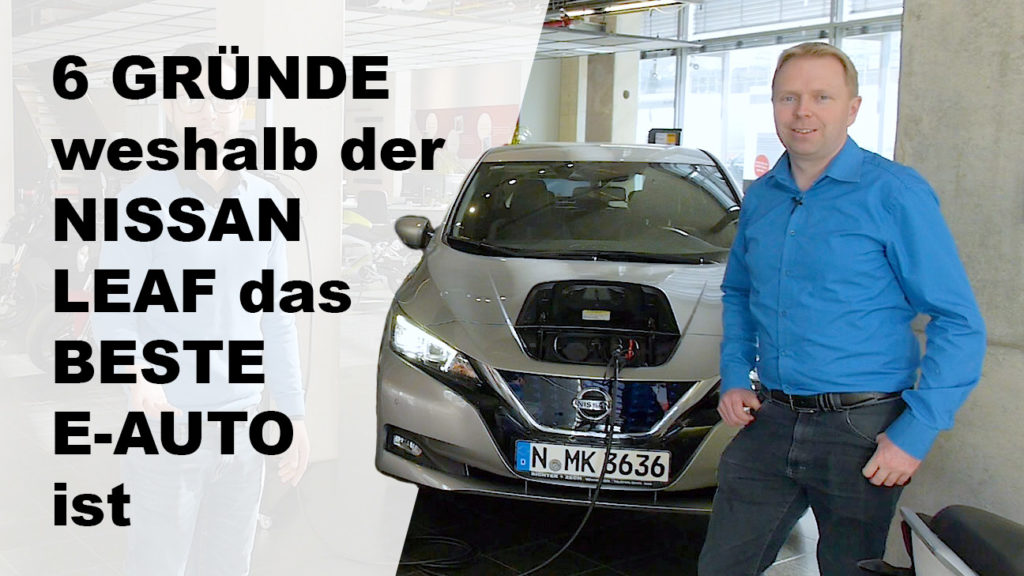Nissan Leaf: 6 Gründe, warum er das beste E-Auto ist. Verkäufer präsentiert E-Auto.